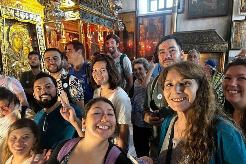 Captivated individuals experiencing pure joy at the Nativity Church during a Bethlehem half-day tour, immersing in the Holy Land's heritage and spiritual essence