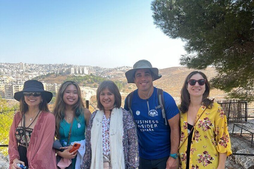 Vibrant participants on a Bethlehem half-day tour, discovering the enchanting Shepherds' Field Monastery, immersed in its spiritual aura and cultural heritage