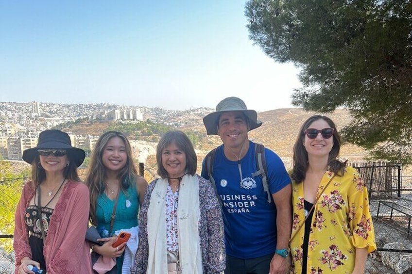Vibrant participants on a Bethlehem half-day tour, discovering the enchanting Shepherds' Field Monastery, immersed in its spiritual aura and cultural heritage