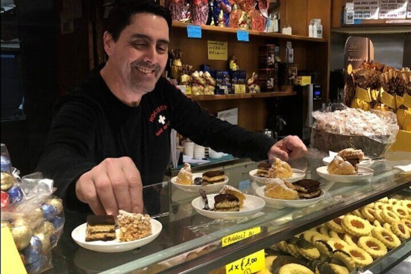 Local family owned pastry shop owner preparing our tastings. Food and wine tour Venice. 