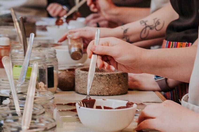 You'll mold your chocolates with a dozen toppings to choose from