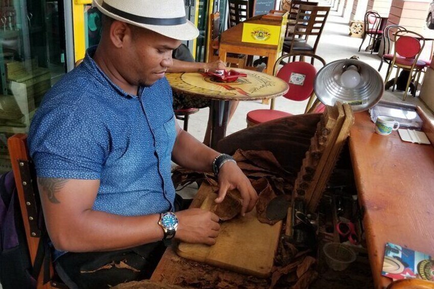 Rolling tobacco leaves into cigars