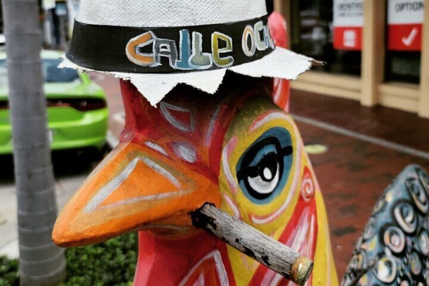 We will teach you about the cultural significance of the roosters in the Cuban community.