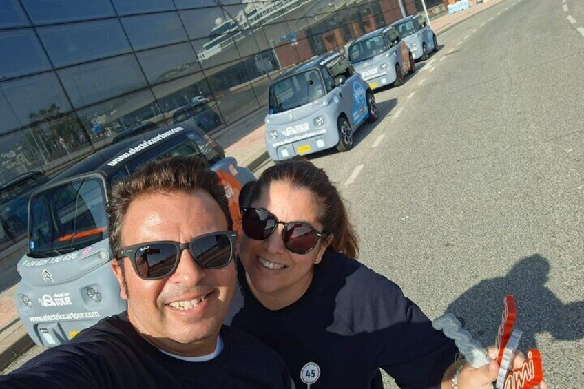 We are Gemma and Alex, who are in charge of showing you our city with our electric car tours.