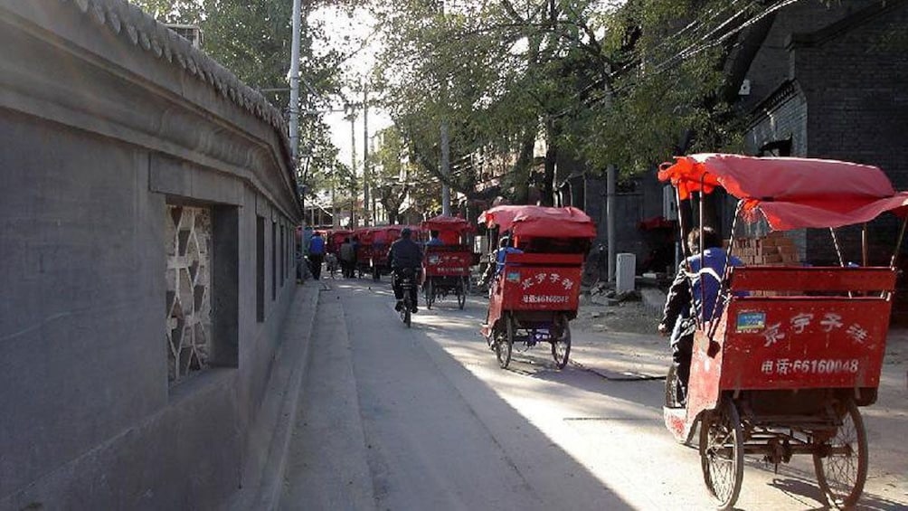 Red bike taxis on the road in Beijing