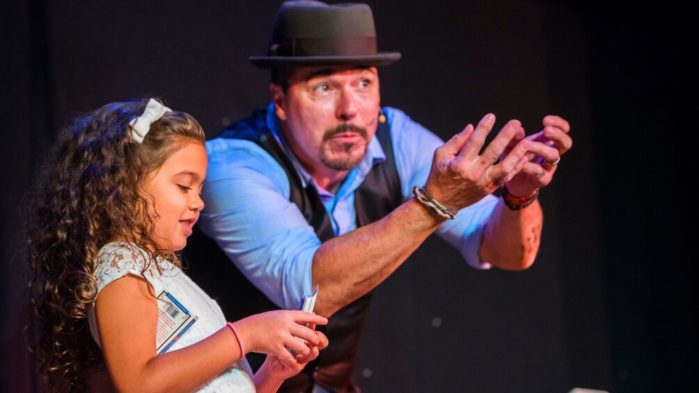 Girl assists a magician