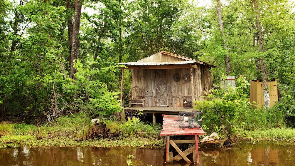old shack and pier in bayou swamp in New Orleans