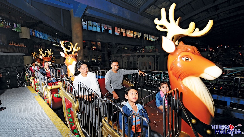 family on reindeer train in kuala lumpur