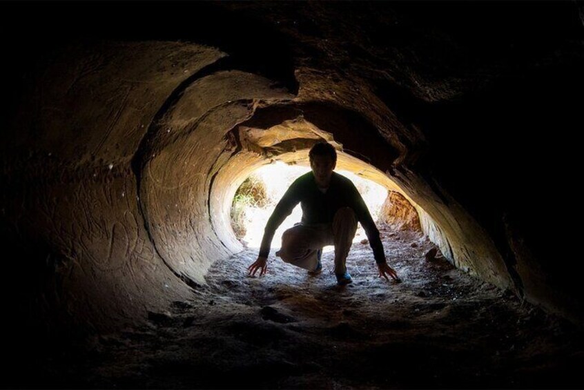 Enter the legendary tunnel of Ana o Keke, or "The Virgin Cave".