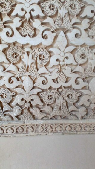 Intricately carved marble walls at Alhambra Palace