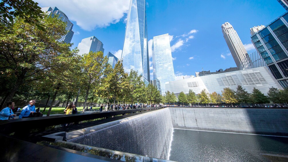 View of One World trade center and reflecting pool at the National September 11 Memorial Museum in New York