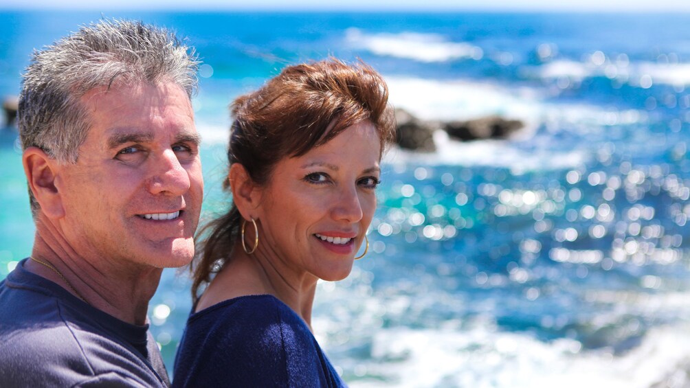 Couple posing in front of ocean view near San Diego California