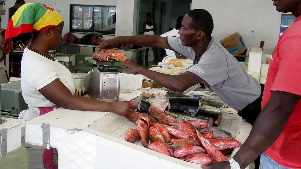 Locals at the fish market in St. George's marketplace in Grenada
