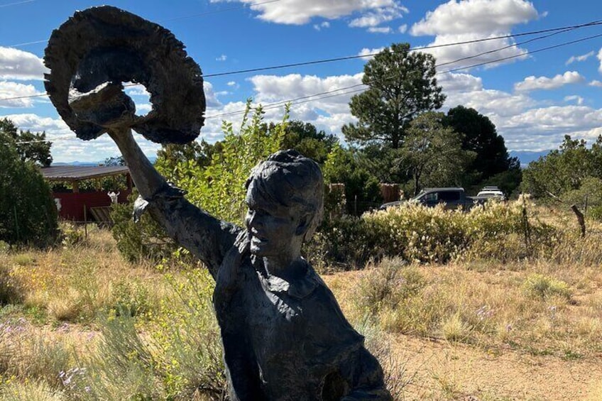Sculpture of a young boy greeting the merchants arriving on the Santa Fe Trail.