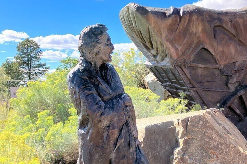 Sculpture of an Indigenous man at the Old Santa Fe Trail monument.