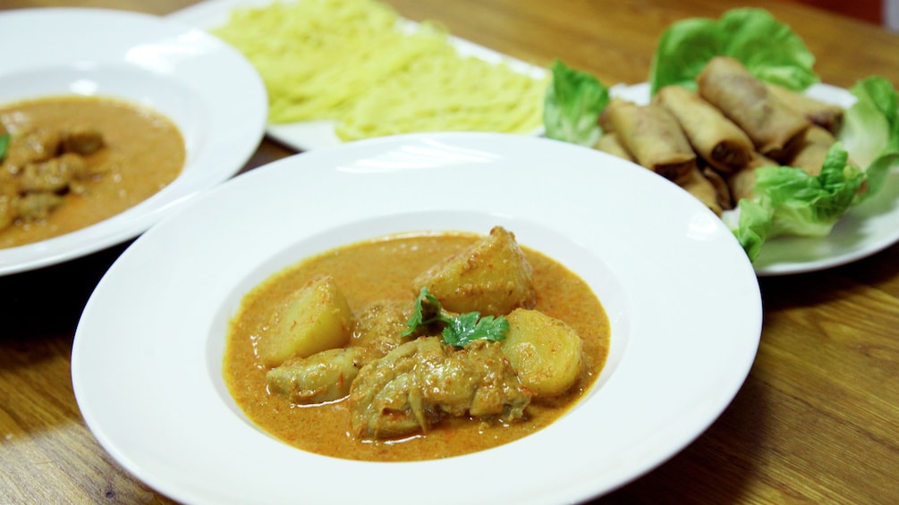Close view of curry and egg rolls in Singapore