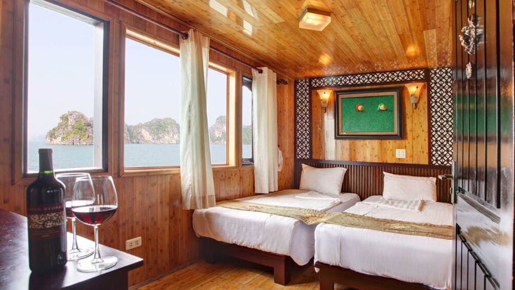 double beds inside the living quarters of the boat in Hanoi
