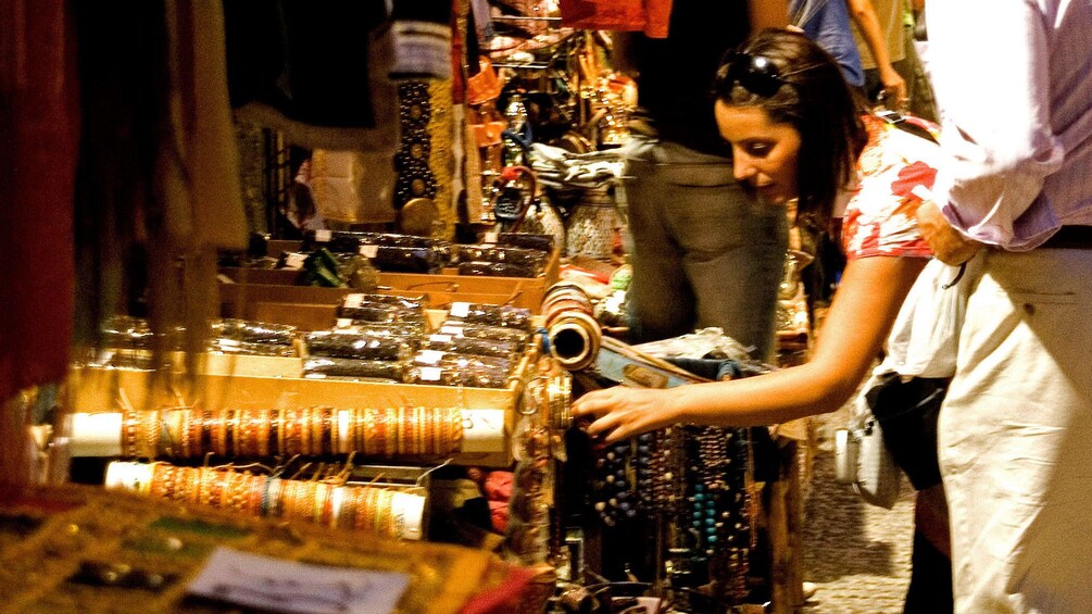 Girl shopping in jewelry at market
