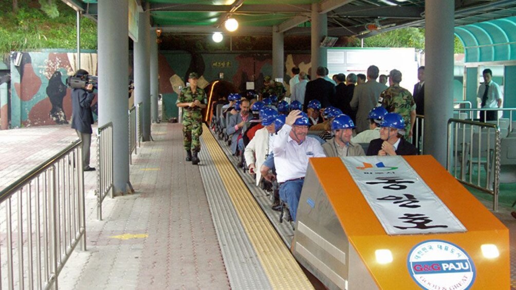 people in seats of trolley in seoul