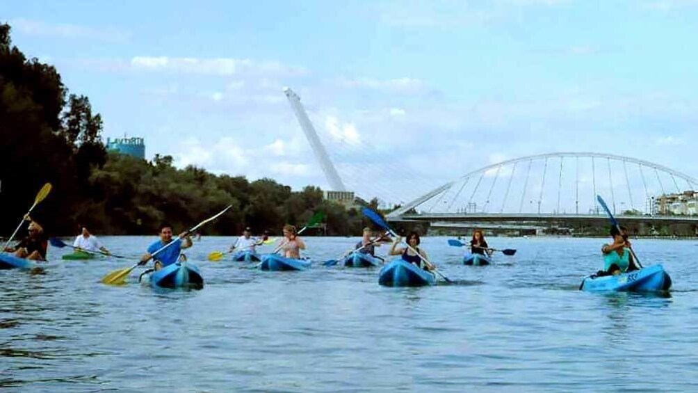 scattered kayakers paddling in the water in Spain