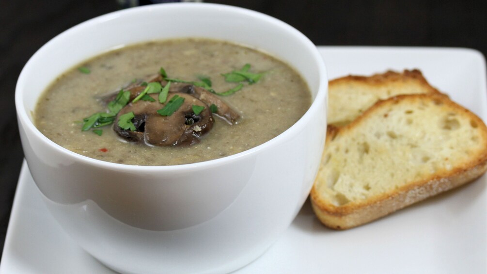 Cup of mushroom soup and crostini