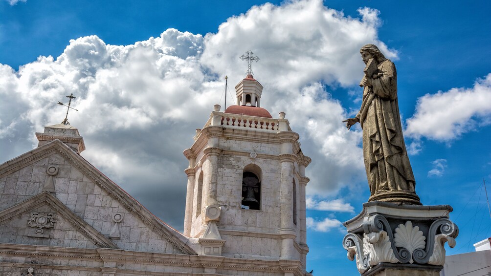 Outside of cathedral with statue in foreground in Cebu