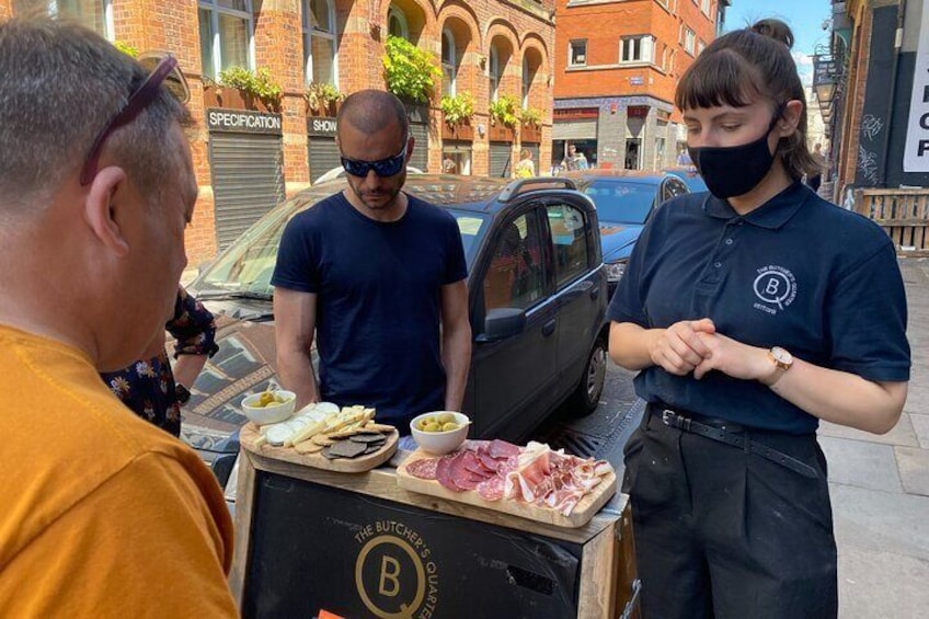 Charlotte talking us through our local cheese and meat platter.