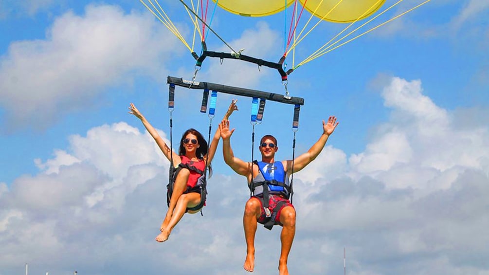 Two people parasailing