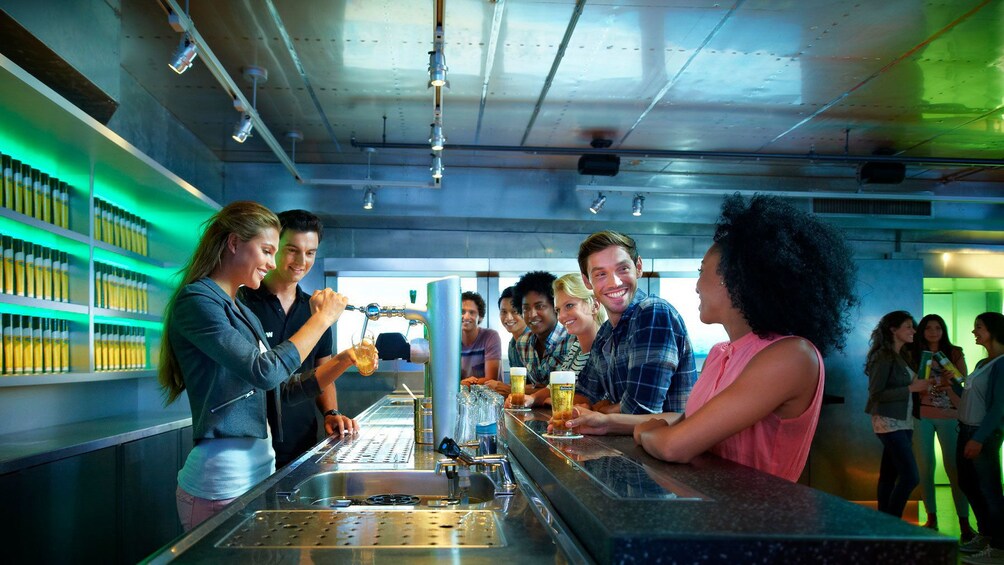 People at tasting bar in Heineken brewery in Amsterdam