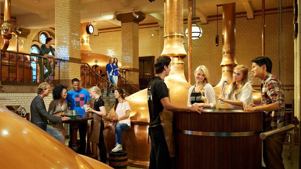 People in Heineken brewery in Amsterdam 
