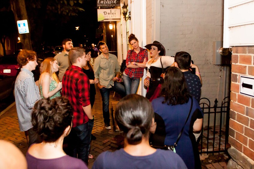 Guide outside a pub leads group 