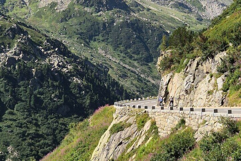 Alpine Pass Descent: Downhill Cycling Adventure in the Swiss Alps