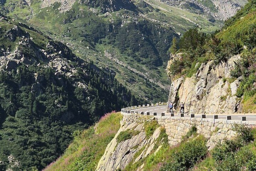 Alpine Pass Descent: Downhill Cycling Adventure in the Swiss Alps