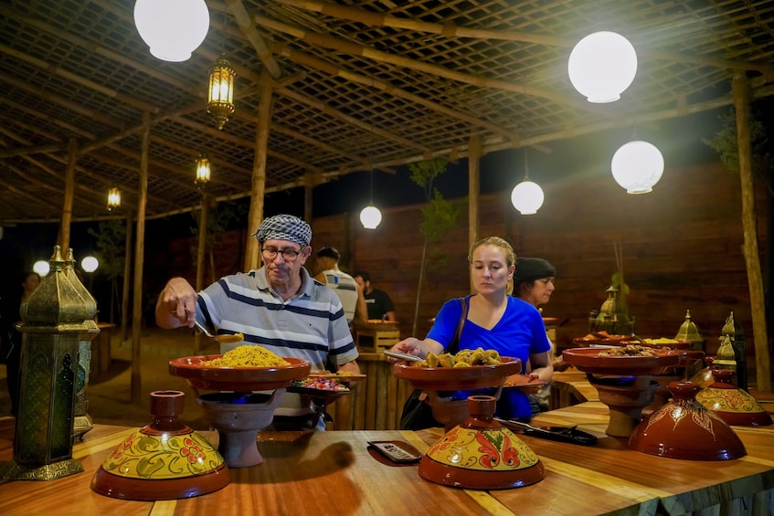 Red Dunes Quad Bike, Sandsurf, Camels & Arabian Buffet Dinner at Al Khayma
