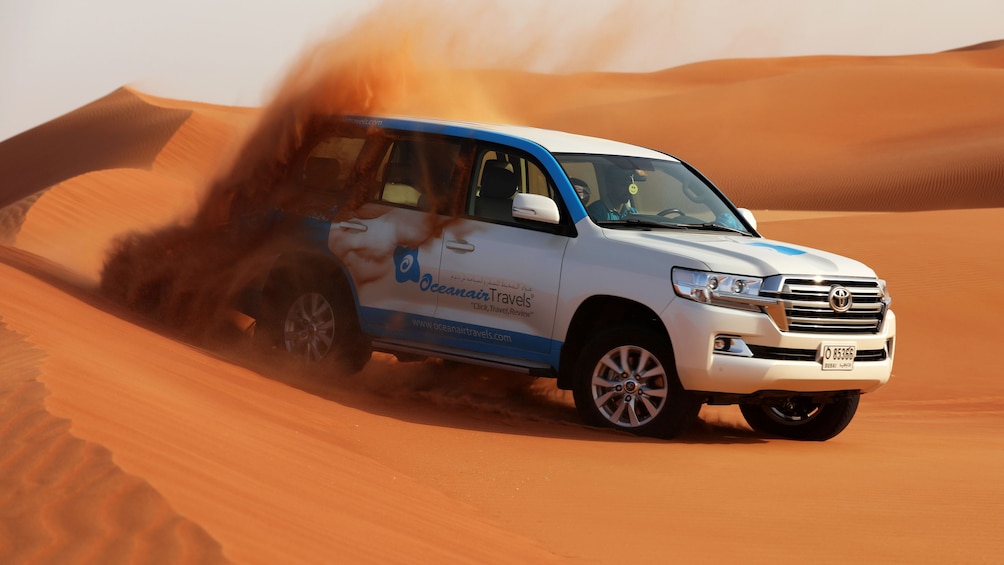Dubai Morning Safari: Red Dunes, Sandsurf, Camels & Brunch
