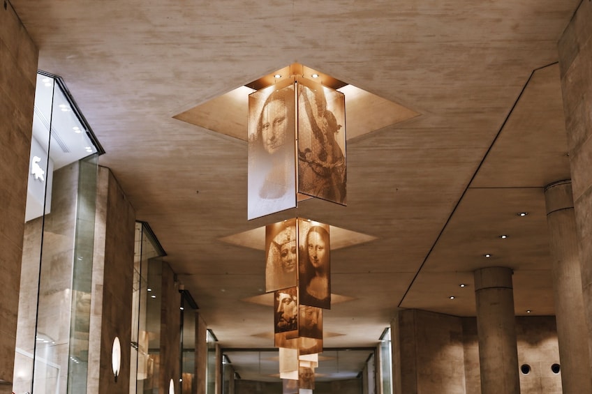 Artistic decor on the ceiling of the Louvre Museum in Paris