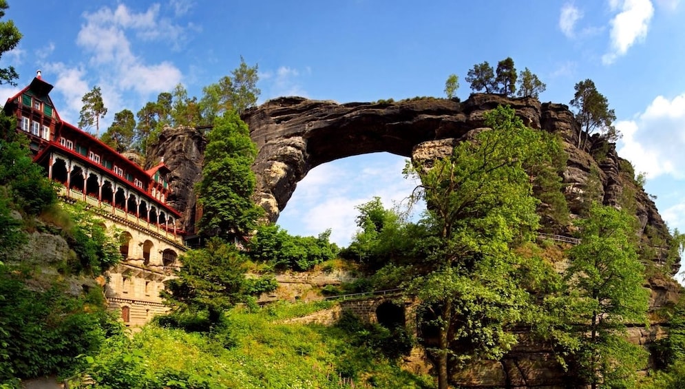 Hotel and arched rock formation in the mountains in Switzerland