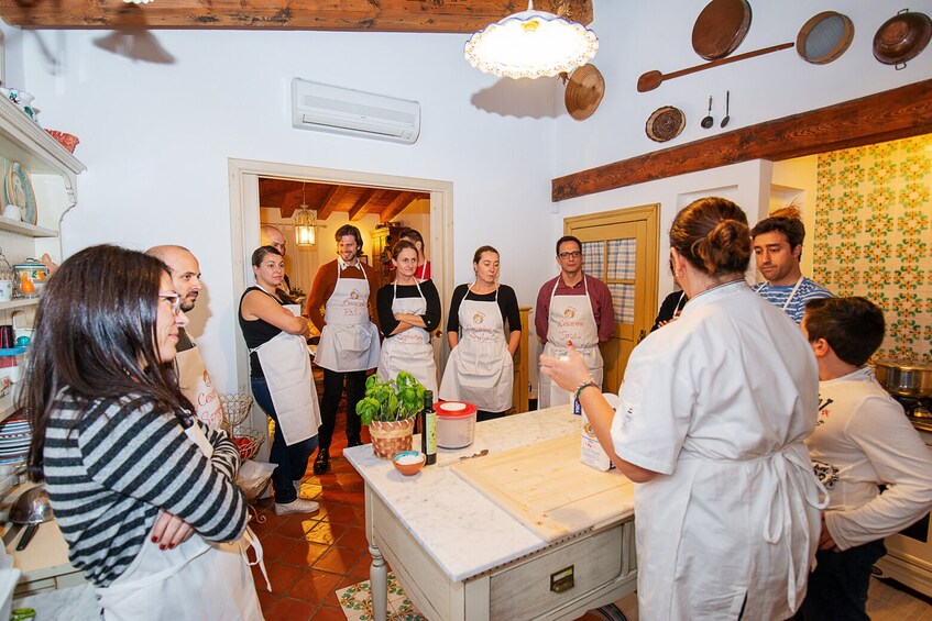 Private Market tour + Cook + Dine in a local home in Lucca