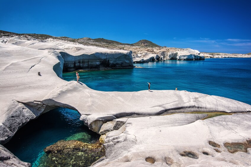 Bright blue lagoon of Milos Island in Greece