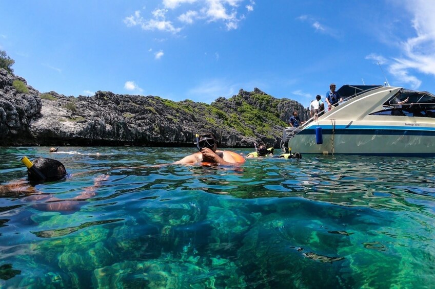 Guests snorkeling around Wao Island