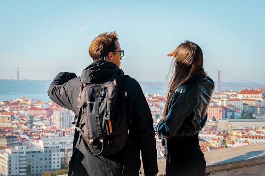 Tourists enjoying a tuk tuk guided tour in Lisbon