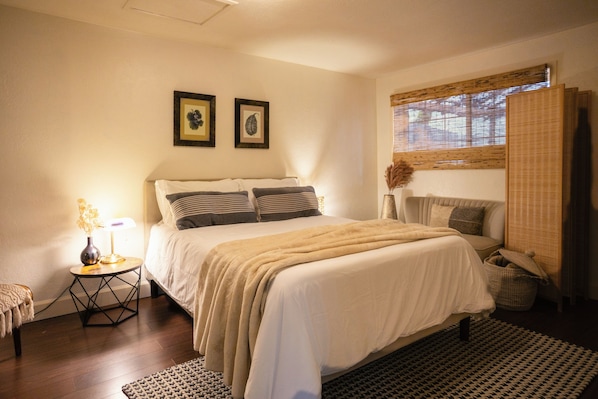 Warm-lit bedroom for restful nights.