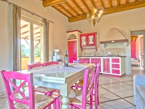 Table, Furniture, Property, Countertop, Cabinetry, Chair, Wood, Kitchen, Lighting, Interior Design