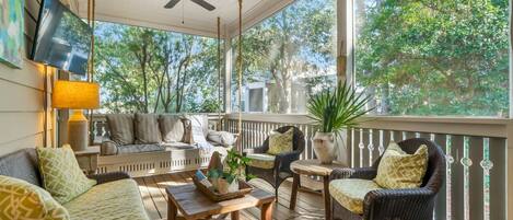 Enjoy a relaxing day with ample seating arrangement on the porch.