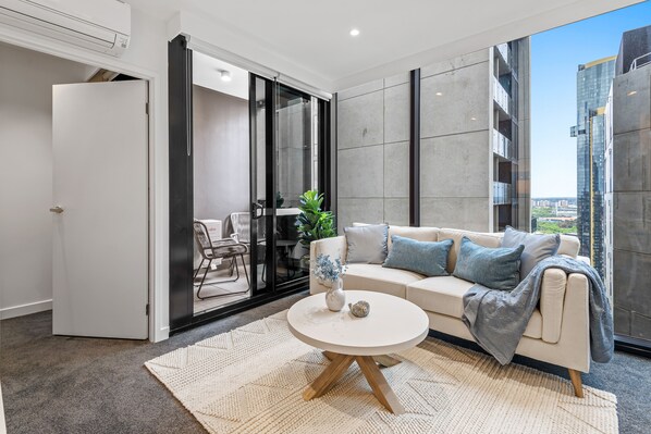Sip your morning coffee on private balcony with warm & inviting ambiance