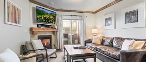 Bear Hollow Lodges 4102:  Cozy up by the fireplace and catch your favorite shows on TV.  Through the sliding door to the outside balcony with seating and a grill.