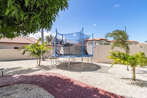 A trampoline at the home, offering a fun and enjoyable outdoor activity.