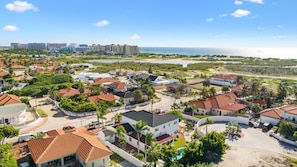 An aerial view demonstrating the home's proximity to high-rise hotels and its convenient location within the hotel district, as well as its close proximity to the beach.