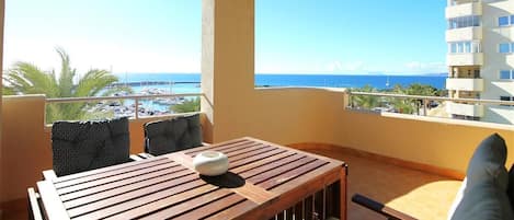 Lovely south-west balcony with outdoor dining area and sea views