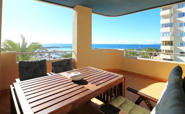 Lovely south-west balcony with outdoor dining area and sea views